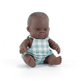 A 21cm tall baby doll depicting an African boy. The doll has dark skin and is wearing a green and white checkered outfit.