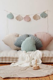 Powder mint velvet leaf cushion with soft, plush texture and pastel color palette. Features a mix of round and shell-shaped decorative elements.