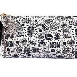 White black makeup pouch with text pattern, words allover design, rectangular shape, Belgian attitude print