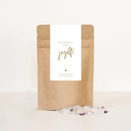 A relaxing bath salt product in a simple, natural-looking packaging. The product appears to be a bath salt blend, likely containing soothing and aromatic ingredients. The packaging emphasizes a "moment for yourself" theme, suggesting this product is intended for self-care and relaxation.