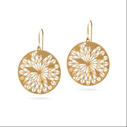 Gilded dreamcatcher-inspired statement earrings with intricate laser-cut designs.