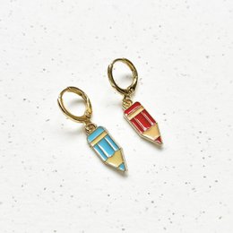  Colorful drop earrings in the shape of pencils with gold-tone hardware.