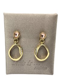  Gold-tone hoop earrings with teardrop-shaped pendants.