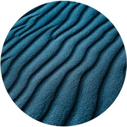 Wavy wall circles in various sizes, featuring a textured, wavy pattern in a deep teal blue color. The circular design creates an eye-catching, modern accent for any wall.