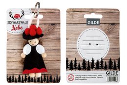 Felt key holder with a penguin design, suitable for kids. Features a red scarf and a wooden background with a forest silhouette.