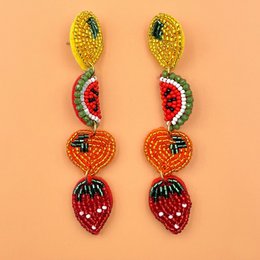  Colorful seed bead fruit earrings featuring strawberry, watermelon, corn, and cherry designs in red, yellow, green beads.