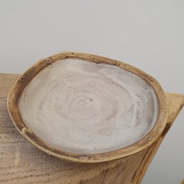 Handmade stoneware dessert plate in a creamy white matte finish, approximately 16 cm in diameter.