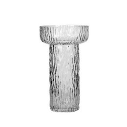 A tall, cylindrical glass vase with a textured, ribbed surface. The vase has a clear, transparent appearance and appears to be made of high-quality glass.