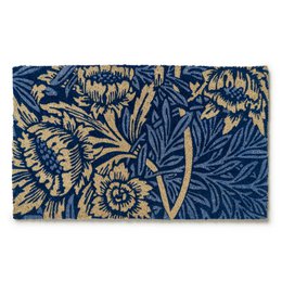 A rectangular blue and tan coir doormat with a floral pattern featuring tulips and willow leaves.

The Victoria and Albert Museum Tulip and Willow Coir Doormat is a rectangular doormat made of coir fiber. The doormat features a blue background with a repeating floral pattern in tan and gold colors. The pattern includes stylized tulips and willow leaves. The doormat is available in two sizes: 45x75 cm and 60x90 cm, both in a blue color.