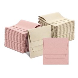  A set of 20 microfiber jewelry pouches in beige and pink colors, available in 8x8cm and 10x10cm sizes, suitable for storing and gifting small jewelry items.