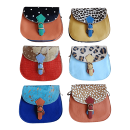  Leather animal print cross-body bag with adjustable strap and flap closure. Available in various colors and patterns.