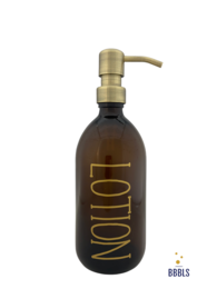 A brown glass soap dispenser with a gold-colored pump and the word "Lotion" printed on the bottle. The dispenser has a capacity of 500ml.