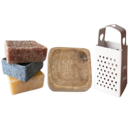 A set of green and white bath brushes with a ribbon bow, labeled "Gnome Spa Co. Bath Soap".