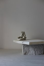 Handmade ceramic candle holder in a minimalist, modern design. Features a round, tall shape in a neutral color palette.