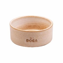 Desert sand dog food bowl made of durable material, suitable for small to medium-sized dogs. Features the word "DOGA" embossed on the side.