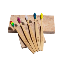 Bamboo toothbrush with colorful bristles, made of sustainable materials.
