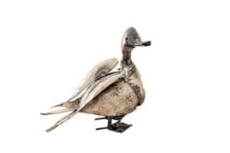 White and gray metal duck sculpture with a happy expression, suitable for garden decor.