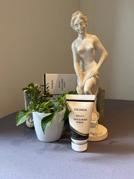 Bright, exfoliating face and body scrub in 50ml container. Contains natural ingredients for gentle skin cleansing.