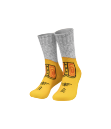 Gray and yellow silly socks with playful design, fun novelty socks with colorful pattern details.