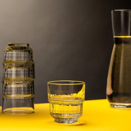 Clear glass water glasses with a textured pattern, suitable for everyday use or special occasions.