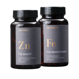 Zinc and iron supplements in black bottles labeled "Zn" and "Fe" for beauty and brain support.