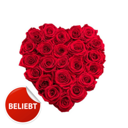 A heart-shaped bouquet of vibrant red roses, perfect for expressing love and affection. The bouquet features a variety of sizes, from small to extra-large, and is presented in a stylish black box with a red ribbon.
