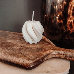 Swirly white pillar candle with a unique spiral design.
