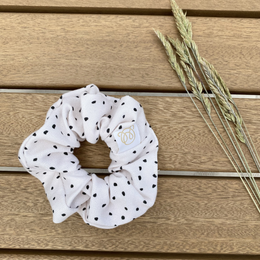 Cream-colored bamboo scrunchie with a soft, textured fabric.
