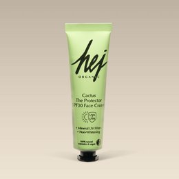  A green 30ml face cream tube with the product name "The Protector SPF30 Face Cream". The product features include a mineral UV filter, hyaluronic acid, and vitamin C for intensive care and high protection.