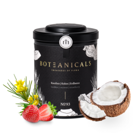 A round, tall black canister with the label "Botanicals" contains a rooibos tea blend with coconut and strawberry flavors. The tea leaves are visible, along with dried strawberry pieces and coconut shreds.