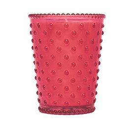 A tall, round glass candle in a chestnut color with a hobnail texture and pattern. The candle has a rustic, vintage-inspired design.