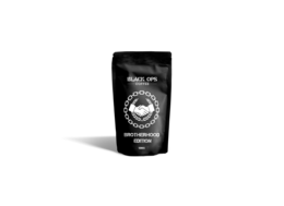 Dark roasted coffee beans in a black package with a white logo and text "BROTHERHOOD COFFEE" on it.