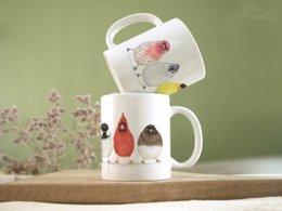  Ceramic mug featuring colorful illustrations of North American birds. Ideal for coffee or tea, with a whimsical animal design.