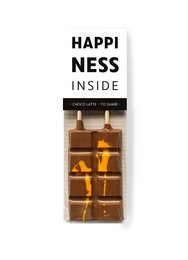 Chocolate bar with "Happiness Inside" text and assorted chocolate pieces.