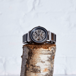 Handmade vegan wood mechanical watch with a unique open-heart design, featuring a wooden case and a visible movement.