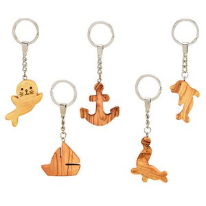 Keychain handmade, sailboat, anchor, seal, seal, dolphin made of olive wood natural 5-fold, (W / H / D) 5x1x14cm