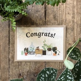 Congratulations card with illustrated plants and potted items. Includes text "Congrats!" in a rustic, handwritten style.
