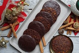 Dark chocolate bars with hazelnut, apple, and cinnamon flavors. Organic, vegan, and made with natural ingredients.