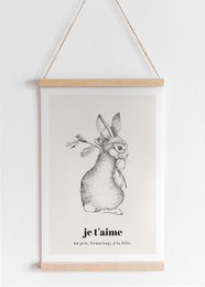 A black and white sketch of a rabbit with the French text "Je t'aime" (I love you) below it, displayed on a wooden frame.