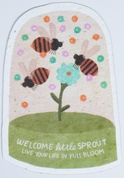 "Colorful postcard with a whimsical flower design and bees, featuring the text 'Welcome little sprout, may your life in full bloom'."