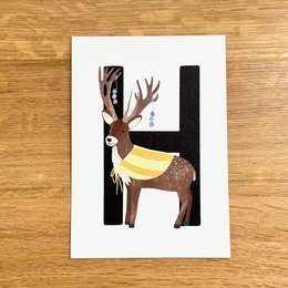 Colorful deer illustration with abstract shapes and patterns. Suitable for greeting cards, posters, or other decorative purposes.