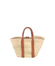 Woven straw tote bag with brown leather handles and trim. Oval-shaped with a spacious interior for shopping or everyday use.