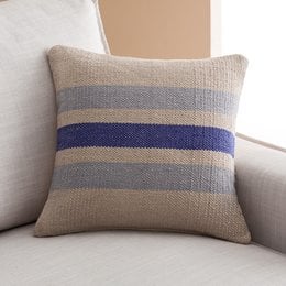 Cushion cover with striped pattern in shades of blue and gray. Made of soft, textured fabric. Suitable for living room, bedroom, or home decor.