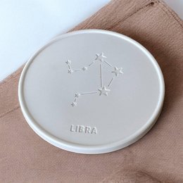  Coasters featuring the Libra zodiac sign constellation design. Available in 1 piece, set of 4, or set of 6. Made of a light-colored material with the Libra constellation etched into the surface.