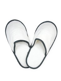 White and anthracite colored slippers with a soft, comfortable design.
