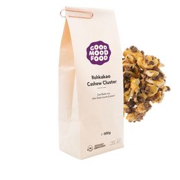 Raw cacao cashew cluster snack with a mix of crunchy cashews and cacao nibs, packaged in a paper bag.

The product is a raw cacao cashew cluster snack, consisting of a mix of crunchy cashews and cacao nibs. The snack is packaged in a paper bag, which is a sustainable and eco-friendly packaging choice.