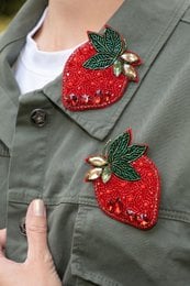 Pair of strawberry brooches, red strawberries with green leaves, embroidered fruit design, cute decorative pins.
