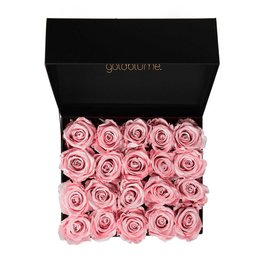 A bouquet of delicate dried flowers in various shades of pink, including Aquamarine, Bridal Pink, Lavender, and Vibrant Red. The flowers are arranged in a stylish black box, creating a sophisticated and elegant presentation.