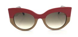 Stylish cat-eye sunglasses in a bold red and beige color combination. Features a gradient lens for a fashionable look.