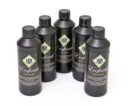 A set of 450 ml Amazona Ecofinish wall art bottles in a dark, earthy green color with a minimalist label design featuring a leaf or plant symbol.